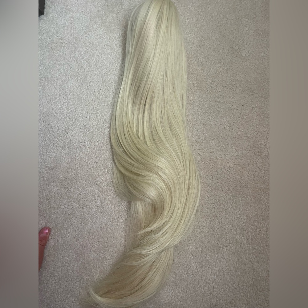 Synthetic clip on ponytail. Color 613,Heat friendly fiber 300 or less. 22” long
